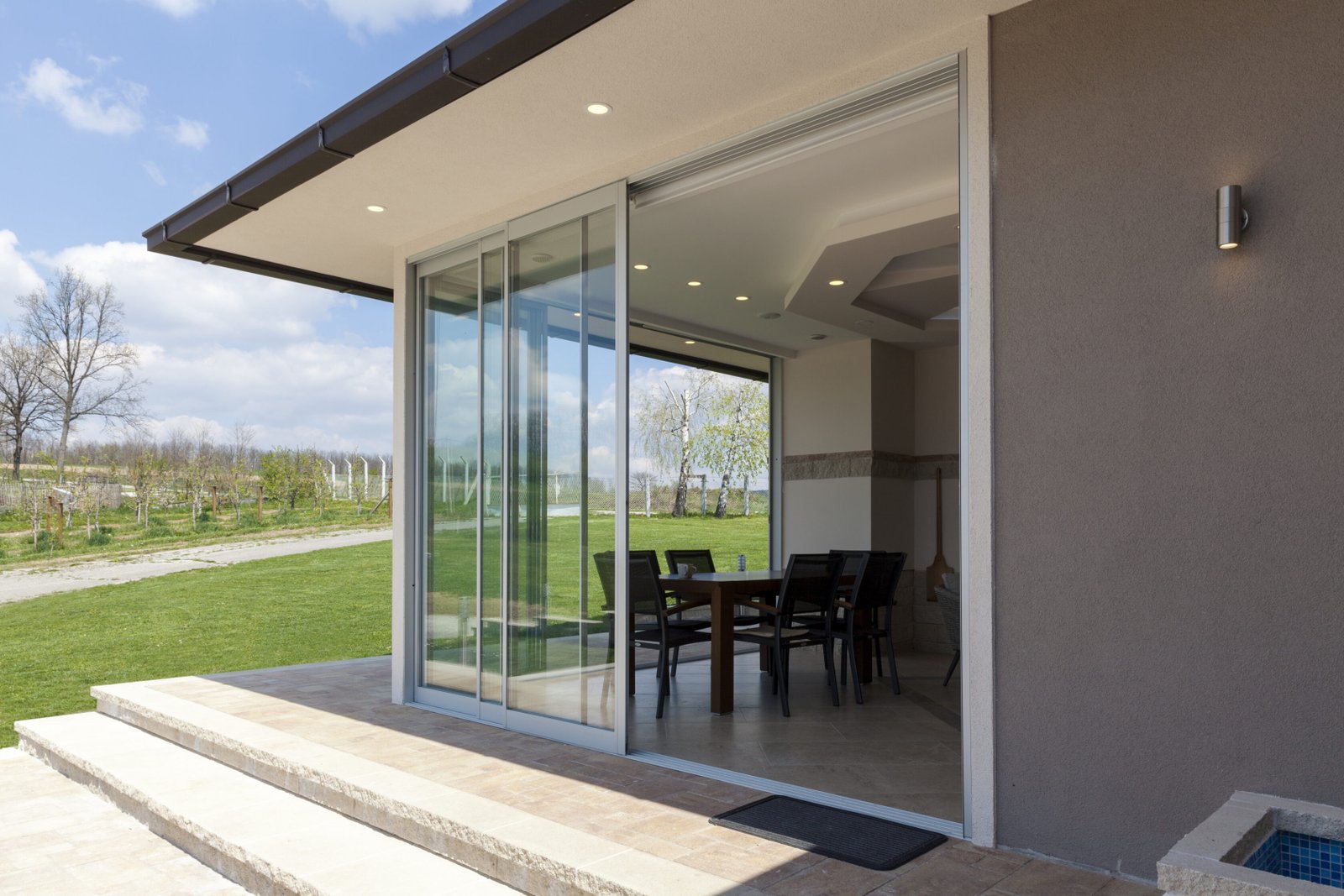 glazed terrace in the countryside with sliding glass