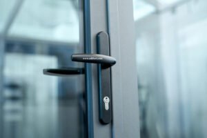 stylish door handle with lock on the glass door. photo with a copy-space.