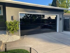 Ultra Modern Black Frameless Glass Garage Doors w: NOW Technology