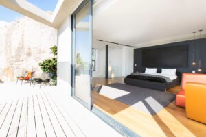 Sliding glass door onto bedroom in modern house